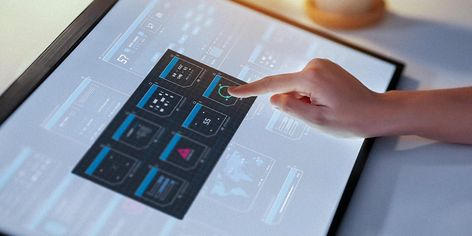 Photo of a hand interacting with a touch screen device