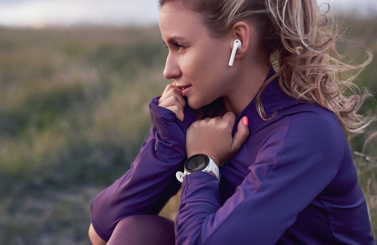 Woman wearing wireless ear buds