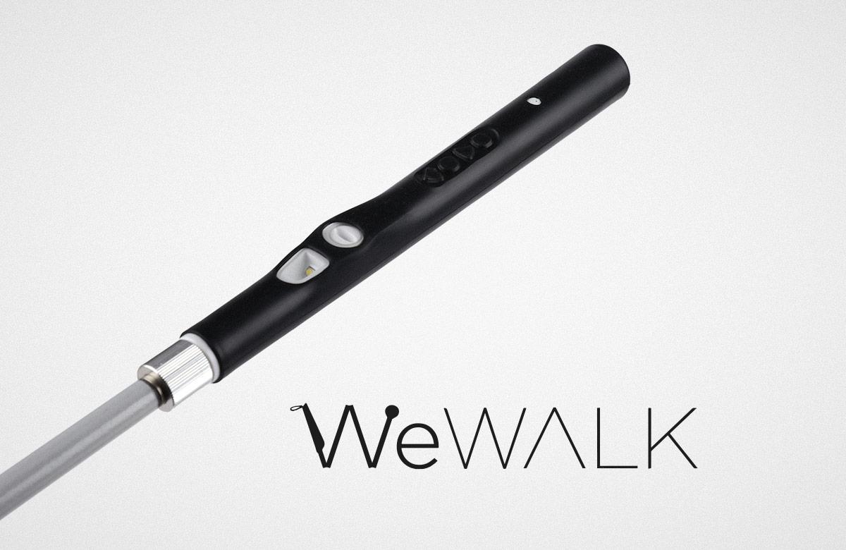 WeWALK logo beneath the handle portion of WeWALK's Smart Cane 2