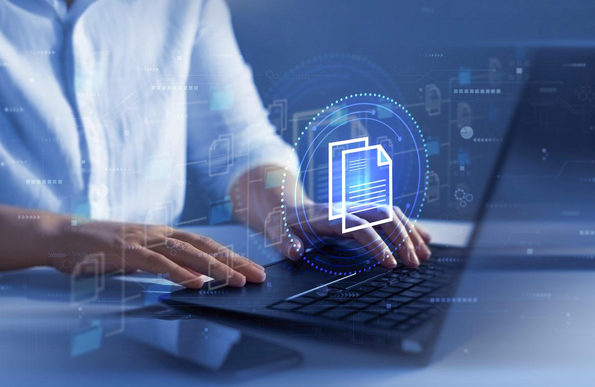 Person typing on a laptop with a digital icon of two documents, representing file sharing or document processing, overlaid.