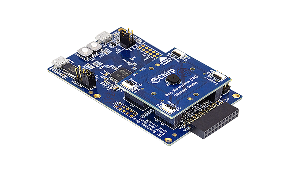 DK-CH101: Two PCBs stacked together with many small chips and components attached to them