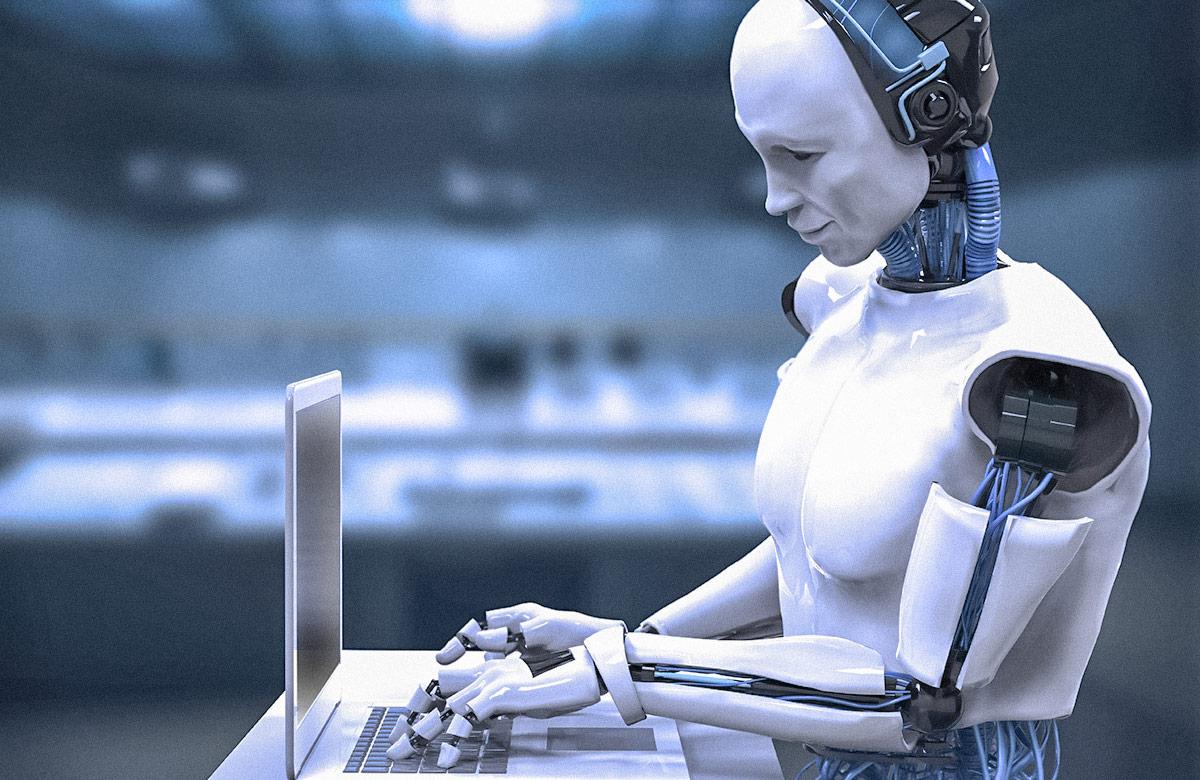 Humanoid robot working at a laptop