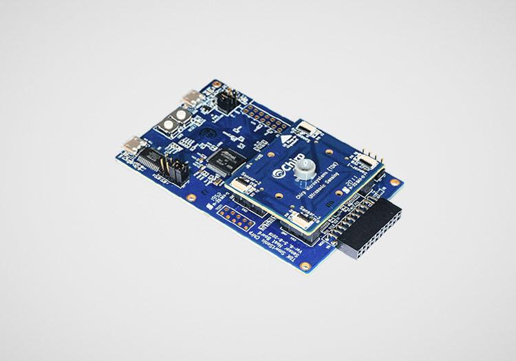 DK-CH201: Two PCBs stacked together with many small chips and components attached to them