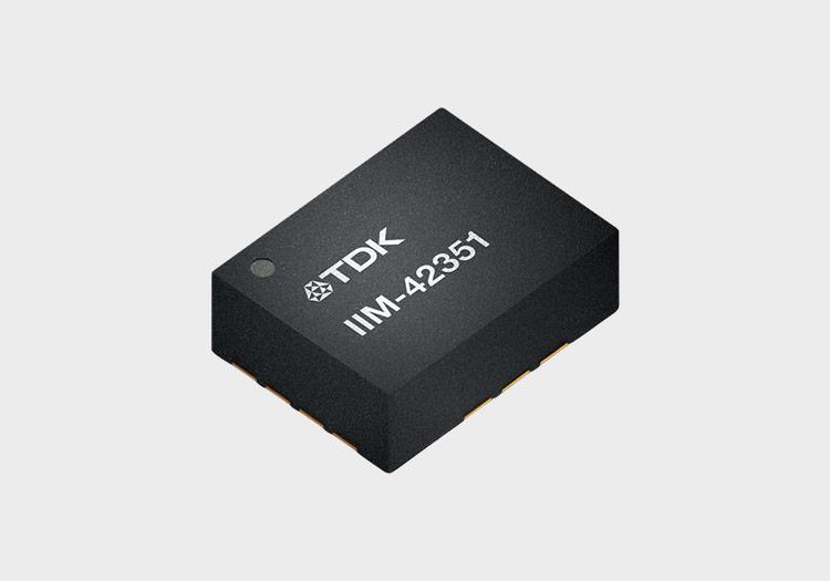 Illustration of a microchip with the TDK logo and "IIM-42351" etched into its surface
